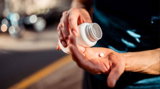 Best men’s health supplements 2025 on Amazon, multivitamin and probiotic bottles with fitness props